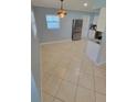 Kitchen area with stainless steel refrigerator and tile floors at 904 W Braddock St, Tampa, FL 33603