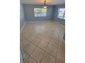 Living room area featuring tile floors and bright windows at 904 W Braddock St, Tampa, FL 33603