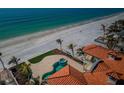 Luxury beachfront home featuring a private pool, spa, and tile roof with stunning ocean views at 15912 Gulf Blvd, Redington Beach, FL 33708