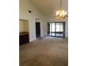 Spacious living room features a wet bar and sliding doors to the exterior at 2567 Bentley Dr, Palm Harbor, FL 34684