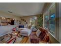 Inviting living room with a large window, comfortable seating, and natural light enhancing its charm at 2749 16Th N Ave, St Petersburg, FL 33713