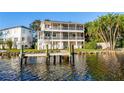 Waterfront home features multi-level balconies and a private dock, ideal for enjoying scenic river views at 2902 N Shoreview Pl, Tampa, FL 33602