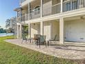 Outdoor patio featuring a fire pit and comfortable seating area, perfect for relaxing and entertaining at 2902 N Shoreview Pl, Tampa, FL 33602