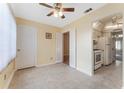 Dining area with fan, neutral walls and tile floor adjacent to kitchen at 5246 81St N St # 6, St Petersburg, FL 33709