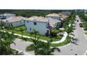 An aerial view of a house on a corner lot, showcasing the manicured lawn and surrounding community at 923 Seagrape Dr, Ruskin, FL 33570