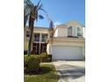 Two-story townhome with attached garage and manicured landscaping at 1050 Starkey Rd # 2503, Largo, FL 33771