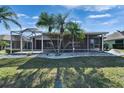 The screened lanai enhances the home's outdoor appeal, offering a blend of comfort and natural beauty at 1228 Caloosa Creek Ct, Sun City Center, FL 33573