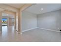 Bright living room with tile flooring, recessed lighting, and views of the water at 16725 Barnwood Pl, Bradenton, FL 34211