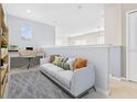 Cozy loft space with comfortable seating, built-in shelves, and a dedicated desk area for work or study at 20033 Heritage Point Dr, Tampa, FL 33647