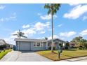 Attractive single-story home with a well-maintained lawn and charming curb appeal at 3832 Star Island Dr, Holiday, FL 34691