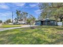 Property view showing home, driveway, and surrounding neighborhood at 4412 W Pearl Ave, Tampa, FL 33611