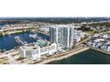 Aerial view of luxury condo building, marina, and parking at 5120 Marina Way # 14002, Tampa, FL 33611