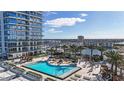 Luxury condo building with resort-style pool and deck area at 5120 Marina Way # 14002, Tampa, FL 33611