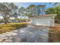 Spacious driveway leading to an attached two-car garage in a well-maintained neighborhood at 6905 122Nd Dr, Largo, FL 33773