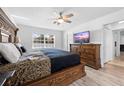 Bright bedroom with view of the backyard, a flatscreen TV, and a comfortable king-sized bed at 10340 Ventura Dr, Spring Hill, FL 34608