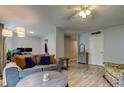 Bright and airy living room featuring wood-look tile floors and neutral paint at 10800 Us Highway 19 N # 108, Pinellas Park, FL 33782