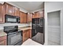 Well-equipped kitchen featuring stainless steel appliances, granite countertops, and ample cabinet space at 12973 Dream Catcher Way, Riverview, FL 33579