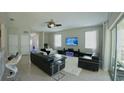Open living room with sleek leather sofas, modern furnishings, and plenty of light at 3328 W Palmetto St, Tampa, FL 33607