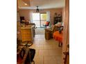 Living room with tile floors, neutral furniture, and a sliding door to a balcony or patio at 3730 42Nd S Way # K, St Petersburg, FL 33711