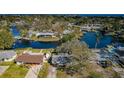 Panoramic aerial view of a neighborhood with waterfront homes along a tranquil bay area at 4601 Carson Ne St, St Petersburg, FL 33703