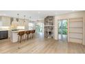 Gourmet kitchen with a marble island, pendant lights, stainless steel appliances, and breakfast bar seating at 4777 Duhme Rd # 1A, St Petersburg, FL 33708