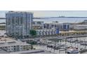Stunning aerial view of waterfront property and marina with city skyline in the distance at 5120 Marina Way # 6603, Tampa, FL 33611