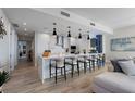 Modern kitchen boasts sleek countertops, island seating, and stainless steel appliances at 5120 Marina Way # 6603, Tampa, FL 33611