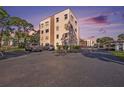 Apartment building exterior with ample parking spaces available to residents at 5980 80Th N St # 410, St Petersburg, FL 33709