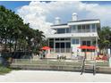 Modern beachfront home with an outdoor lounge area at 1522 Gulf Blvd, Indian Rocks Beach, FL 33785