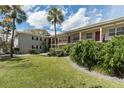 Multi-Gathering home with an exterior with lush green lawn and mature landscaping at 2207 S Carolina Ave # 16, Tampa, FL 33629