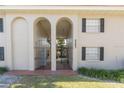 Exterior arches mark the entrance of this multi-Gathering property with black shutters and a well-kept lawn at 2207 S Carolina Ave # 16, Tampa, FL 33629