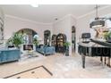 Bright and airy living room featuring modern decor, stylish furnishings and an open layout at 27045 Firebush Dr, Wesley Chapel, FL 33544