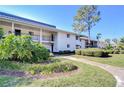 Well-maintained condominium building with manicured landscaping and a welcoming entrance at 29230 Bay Hollow Dr # 3274, Wesley Chapel, FL 33543