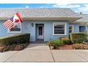 Charming light blue home featuring manicured landscaping and a welcoming front entrance at 3649 Teeside Dr, New Port Richey, FL 34655