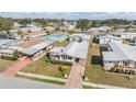 Drone shot showcasing the community layout of single story homes and nice landscaping at 5538 Antigua Dr, Zephyrhills, FL 33541