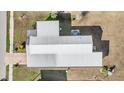 Aerial view of the roof and yard, including the American flag on the property at 5538 Antigua Dr, Zephyrhills, FL 33541
