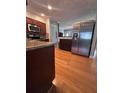 Modern kitchen with stainless steel appliances, granite counters, and lots of storage space at 8139 38Th N Ave, St Petersburg, FL 33710
