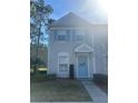 Charming two-story townhome with light blue shutters and an inviting front entrance at 8541 Hunters Key Cir, Tampa, FL 33647