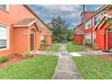 Beautifully landscaped exteriors showcasing the community's inviting curb appeal and walkways at 9204 Lake Chase Island Way # 9204, Tampa, FL 33626