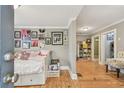 Spacious living area with a gray color palette, hardwood floors, a daybed and custom shelving at 1045 6Th N St, St Petersburg, FL 33701