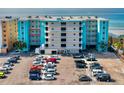 Condo building with a well-maintained parking lot and ocean view at 17200 Gulf Blvd # 302, North Redington Beach, FL 33708