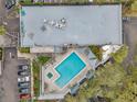 Aerial view of a community pool and lounge area, perfect for relaxing and enjoying the sunshine at 201 W Laurel St # 909, Tampa, FL 33602