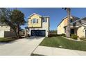 Charming two-story home featuring a spacious two-car garage and well-manicured lawn at 21211 Southern Charm Dr, Land O Lakes, FL 34637