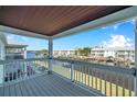 Waterfront balcony view overlooking boat docks, canal, and lush community landscaping at 5152 Salmon Se Dr # C, St Petersburg, FL 33705