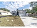 Charming single-Gathering home with an attached garage and freshly cut lawn at 5341 71St N Way, St Petersburg, FL 33709