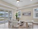 Bright living room featuring neutral tones, wood floors, and a sliding glass door to the patio at 5361 71St N Way, St Petersburg, FL 33709