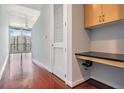 Hardwood floors lead to a wall of windows with a cozy desk nook at 777 N Ashley Dr # 1505, Tampa, FL 33602