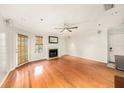 Bright living room featuring hardwood floors and a cozy fireplace at 1000 W Horatio St # 327, Tampa, FL 33606