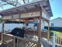 Backyard gazebo with a wooden frame and deck, perfect for outdoor entertaining and relaxation at 14124 Plum Ln, Hudson, FL 34667