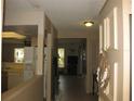 Hallway featuring neutral colored walls and trim at 1440 Hales Hollow Dr, Dunedin, FL 34698